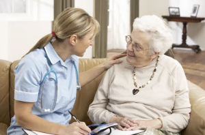 elderly woman in discussion with caregiver